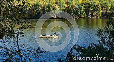 Couple Fishing for Trout on Douthat Lake Editorial Stock Photo